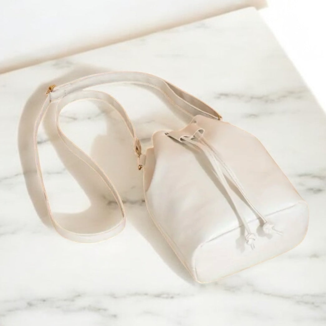 white bucket bag on a marble surface