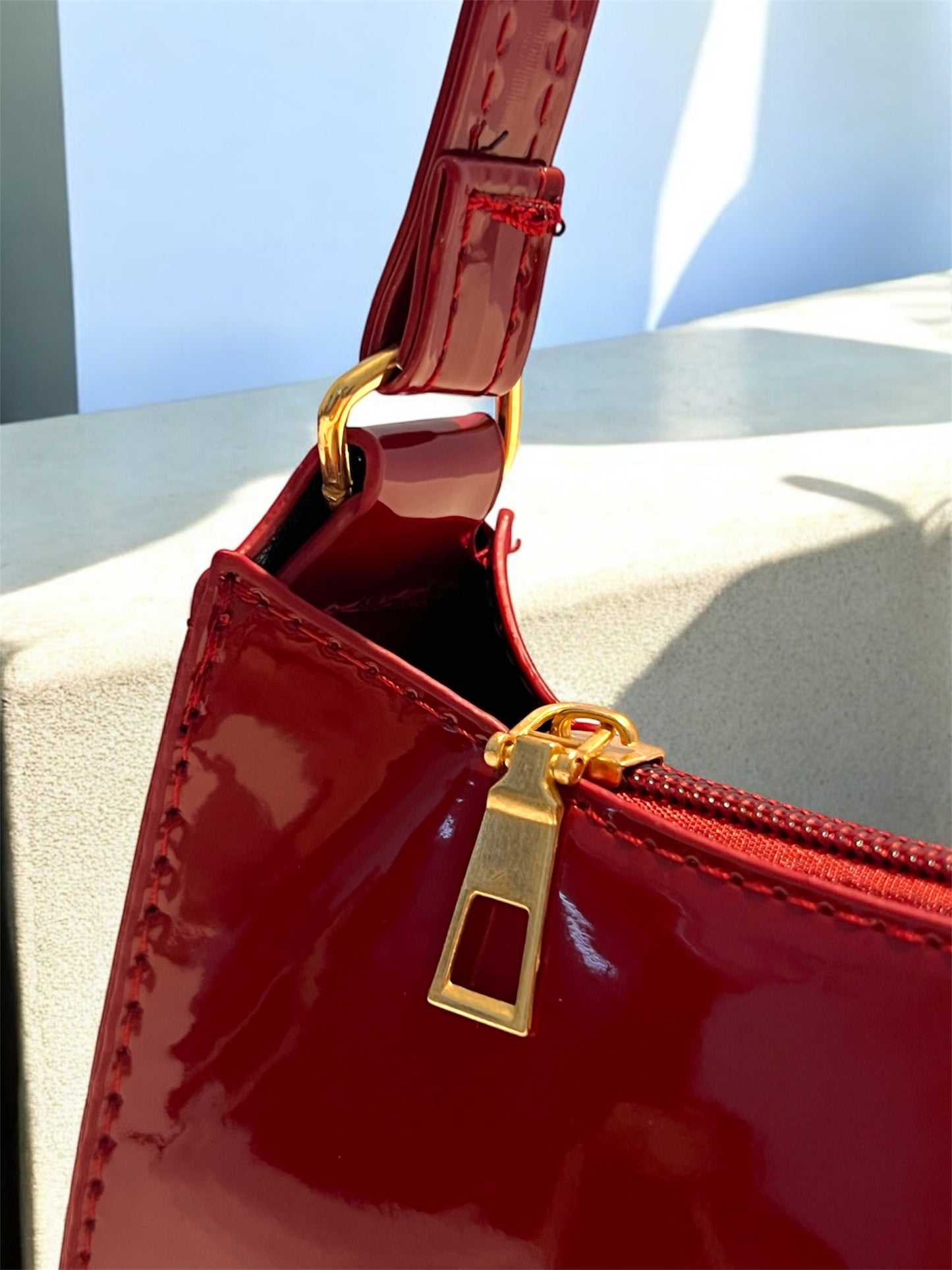 Maroon Patent leather bag close-up