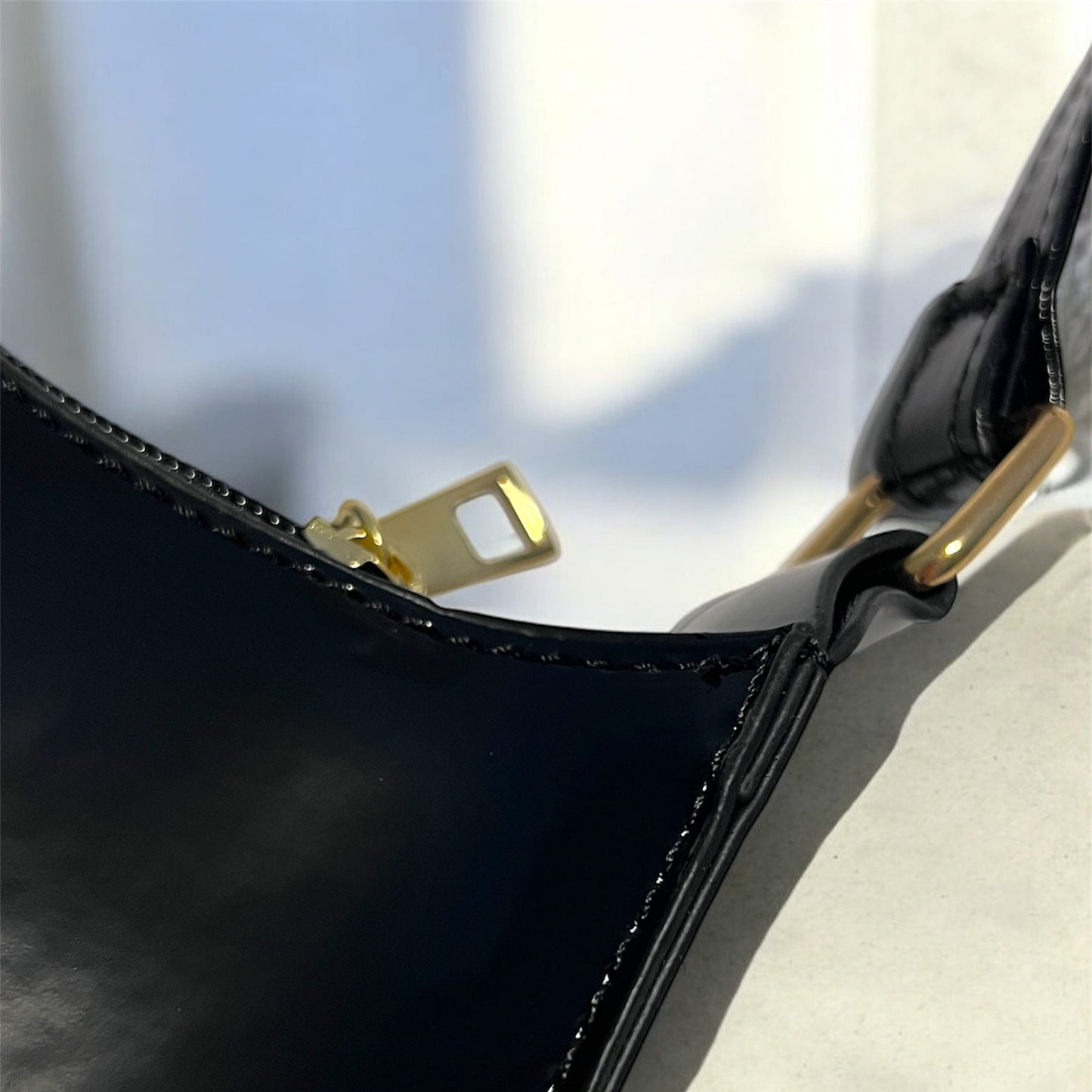 Black patent bag closeup
