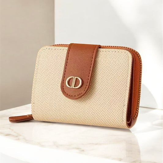 Beige wallet with brown leather strap and clasp on a light background