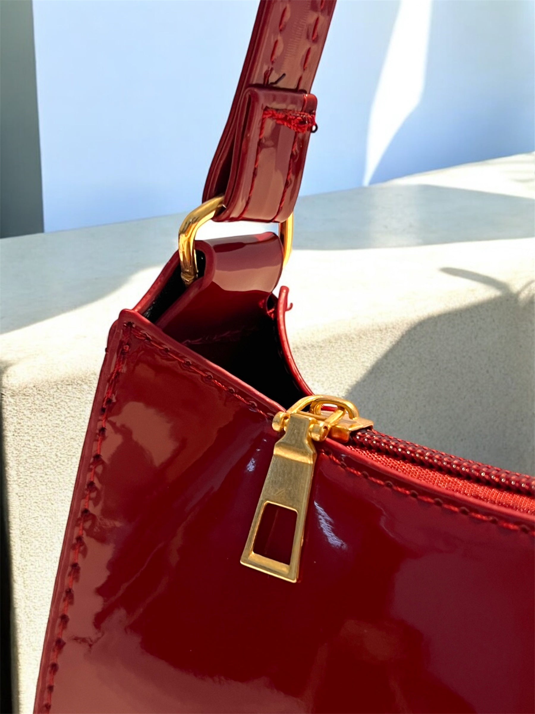 Maroon Patent leather bag close-up
